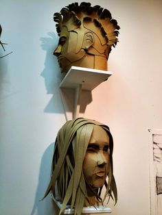 a mannequin's head with long hair on display