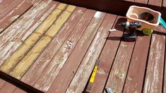 the tools are laying on the wooden deck