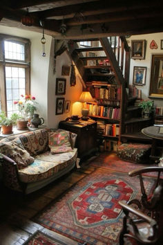 a living room filled with furniture and lots of books