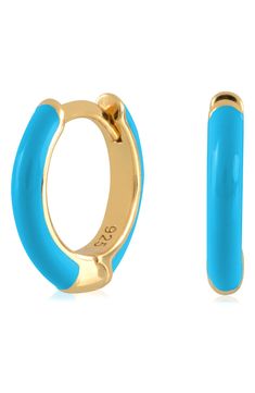 Easy-to-wear hoop earrings will add significant polish to even your most casual ensembles. 1/2" drop; 1/8" width Hinge with snap-post closure Sterling silver with goldtone plate/enamel Imported Trendy Enamel Hoop Jewelry, Blue Enamel Hoop Earrings For Gift, Hoop Huggie Earrings In Enamel, Blue Hypoallergenic Small Hoop Huggie Earrings, Hypoallergenic Blue Small Hoop Huggie Earrings, Blue Huggie Hoop Earrings, Blue Small Hoop Huggie Earrings, Trendy Small Blue Hoop Earrings, Trendy Round Enamel Hoop Earrings