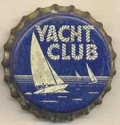 a blue bottle cap with a sailboat on the water and words yacht club printed on it