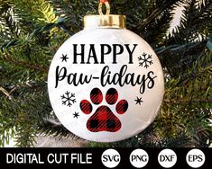 a christmas ornament that says happy paw - paws with a dog's paw print