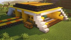 a small yellow house in the middle of a field with stairs leading up to it