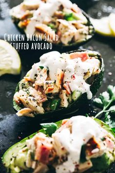 chicken bacon salad stuffed avocado on a baking sheet