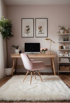 a pink chair sits in front of a desk with a computer on it and two framed pictures above the desk