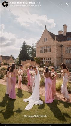 a group of women standing around each other in front of a building