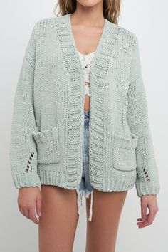 This oversized knit cardigan is perfect for a chilly day! It's available in two different pastel hues, so you can choose the one that best suits your style. With its comfortable fit and professional look, this cardigan is sure to become a favorite in your wardrobe. Oversized fit Chunky sweater texture Long sleeves Cozy pockets Shell: 100% Polyester JN002J Total length: 25" Bust: 38" Height 5'10" / Bust 34" / Waist 24" / Hip 35" Trendy Solid Chunky Knit Cardigan, Trendy Oversized Open Knit Cardigan, Trendy Chunky Knit Sweater Coat For Spring, Soft Knit Open Front Sweater With Relaxed Fit, Casual Textured Knit Everyday Cardigan, Cozy Open Knit Sweater For Loungewear, Trendy Oversized Open Knit Sweater Coat, Casual Everyday Textured Knit Cardigan, Trendy Chunky Knit Open Front Outerwear