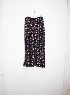 "a vintage navy blue floral button-down midi-skirt ✿ IMPORTANT INFORMATION: * excellent vintage condition * material: 100% rayon * size: large - please check exact measurements below (they're there for your benefit!) ✿ MEASUREMENTS (taken while item is lying flat, some measurements will need to be doubled): * length: 38\" (97cm) * waist: 15.5\" (39cm) * hips: 23\" (58cm) ✿ free UK shipping on orders over £100 with code STRAWBERRY free international shipping on orders over £250 with code LEMON ✿ Spring Workwear Maxi Skirt With Buttons, Navy Pleated Skirt Bottoms For Spring, Navy Pleated Skirt For Spring, Navy Long Skirt For Spring, Navy Flowy Midi Skirt, Midi Skirt Vintage, Blue Floral Skirt, Floral Midi Skirt, Skirt Long