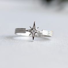 >Starburst with cubic zirconia stone >925 Sterling Silver fully hallmarked. >Sterling silver is an almost pure metal made from 92.5% Silver. >Star at 9.5mm X 9.5mm >Approx 2.5mm band width. FREE SHIPPING USA- All of our jewelry will arrive in custom packaging ready for gift giving. CARE: To prolong the color and shine of your jewelry, avoid contact with perfume, lotion, and water. Store in a bag or jewelry box. SATISFACTION GUARANTEED All pieces are carefully examined prior to del Star Wedding Band, Starburst Ring, Space Rings, Celestial Ring, Ring Art Deco, Deco Ring, Funky Jewelry, Ring Boho, Star Ring