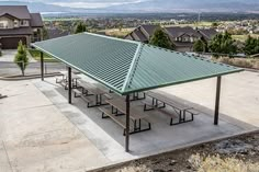 an outdoor picnic area with tables and benches