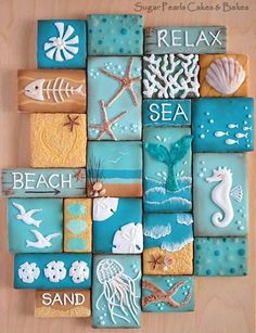 sea themed cookies are arranged in the shape of squares with words and pictures on them