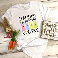 a t - shirt that says teaching my favorite pees is next to some carrots