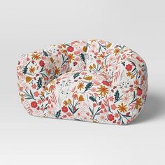 a floral print chair with an orange and yellow flower pattern on the front, sitting in front of a white background