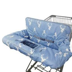 a shopping cart seat cover in the shape of a baby carriage with deers on it