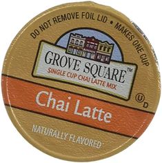 the label for grove square chai latte is shown in gold and orange colors