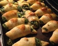 a pan filled with spinach and cheese pastries