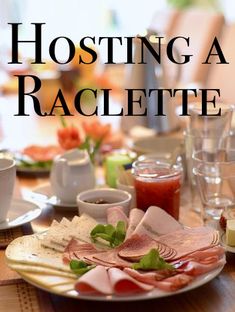 an image of a table setting with food on it and the words hosting a raclette