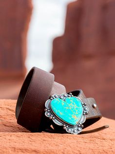 Our Antelope Canyon Turquoise Buckles are inspired artful creations and are a cut from the Kingman, Arizona mine. Huge beautiful chunks of natural American turquoise set in solid sterling silver. These stones are very rare and hard to cut and will make a statement all by themselves. The heart Antelope Canyon buckle is a custom native concho design is amazing with spots, stamping and repoussé. . These are a custom build, so we can do this style on a smaller or bigger profile to meet your budget! Kingman Arizona, Jackson Hole Wyoming, Silver Belt, American Turquoise, Beaded Belt, Saddle Leather, Jackson Hole, Green Tones, Western Art