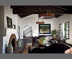 a living room filled with furniture and a fire place