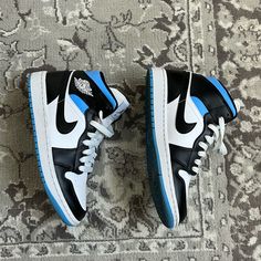 The Women’s Jordan 1 Mid “Black/White/University Blue” Size 7.5w/ 6m Released 2021 No Box Barely Any Creasing Stain On The Side Of The Tongue (Last Pic) No Returns Jordan 1 Mid Black, Womens Jordans, University Blue, Jordan 1 Mid, Jordan Shoes, Jordan 1, Womens Shoes Sneakers, Jordan, University