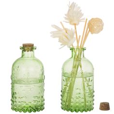 PRICES MAY VARY. Set of 2 embossed glass bottles with stylish vintage design Usable for storing a variety of items, such as plants, food, spices, and more Corked lids keep the contents of the bottle fresh Perfect for display on shelves, tables, or counter tops Approximate Dimensions: 4.9 H × 2.6 Diameter; Opening - 1.0 Diameter (in inches) Add vintage style to your home with these embossed glass bottles with corked lids. Store anything from candies, plants, bath lotions, and much more in these v Reed Diffuser Bottle, Wine Bottle Vases, Decorative Glass Jars, Antique Glass Bottles, Green Glass Bottles, Glass Bottles With Corks, Diffuser Bottle, Glass Bottles Decoration, Cork Lid