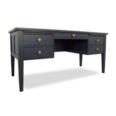 a black desk with two drawers and gold handles