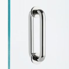 a chrome door handle on a white wall