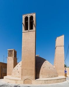 a tall tower with a clock on it's side