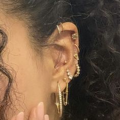 a close up of a person with ear piercings