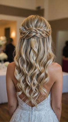 the back of a woman's head with long blonde hair and a tiara