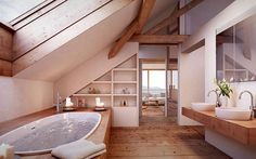 a bath tub sitting inside of a bathroom next to a wooden counter top under a slanted ceiling