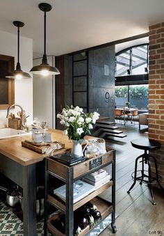 an image of a kitchen with lots of counter space and decor on it's walls