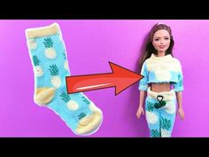 a barbie doll next to a pair of pineapple socks