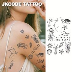 the back of a woman's shoulder with tattoos on it and an image of jellyfish