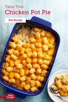 tater tots chicken pot pie in a blue casserole dish next to a white plate