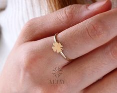 "ABOUT PRODUCT This 14K Yellow Gold Four Leaf Clover Ring is suitable gift for girlfriend, mom and her. You can even buy as a birthday gift for your friends or anniversary gifts, If you want to add a special note we can write for you and put to inside of package. We manufacture our jewelry pieces with carefully and after production we double checking in quality control department. Our main idea is keep our items for daily wearing especially for minimalist jewelry pieces. 14K Yellow Gold Four Lea Yellow Gold Rings For Anniversary Gift, White Gold Engraved Ring For Gift, 14k Gold Flower Ring As A Gift, Dainty Engraved White Gold Ring As Gift, White Engraved Ring As Fine Jewelry Gift, White Engraved Ring As Gift, White Engraved Ring Fine Jewelry For Gift, White 14k Stamped Engraved Ring As A Gift, Mother's Day Gift Rings In Fine Jewelry Style