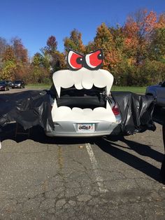 the back end of a car with an angry face on it