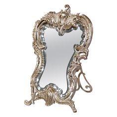 an ornate silver mirror on a white background