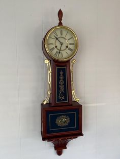 an old clock hanging on the wall