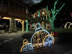 christmas lights on display in front of a house