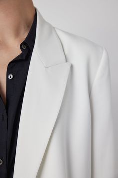 Say hello to your new favorite blazer. A mid-weight woven that’s perfect for now and later, in a seasonless double-breasted silhouette with a slightly oversized fit, which makes it easy to dress up or down. The structured shoulder gives it a flawless drape. Pair with the Bundy Pant for the perfect suit. White Notch Lapel Blazer With Concealed Placket, Timeless White Notch Lapel Outerwear, Modern Spring Outerwear With Pressed Crease, White Spring Blazer With Pressed Crease, Chic White Outerwear With Pressed Crease, White Structured Blazer With Concealed Placket, White Structured Business Blazer, White Structured Business Outerwear, Timeless White Outerwear For Work