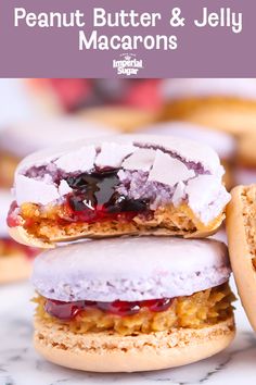 there are two cookies with jelly on them and the words peanut butter & jelly macarons