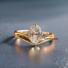 a close up of a ring with a diamond on the top and bottom part of it