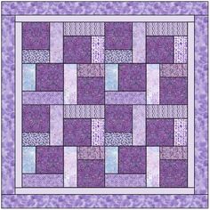 a purple and white quilt with squares on it