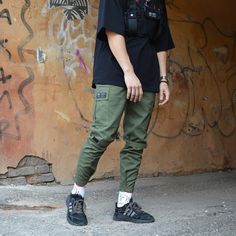 Cargo pants are a trend in recent years. They became so popular that they began to be used everywhere in the most different combinations of clothes. If you want to follow the trend, cargo pants will help you! GENERAL INFORMATION - Sizes: S, M, L, XL, XXL - Colors: black - Fabric: 100% cotton - Slim fit, velcro cuffs at the bottom - Velcro below the knee - Elastic band and cord for adjustment at the waist. Pockets: - main oblique in front - patch pockets in the knee area - overhead at the back SI Urban Cotton Pants For Outdoor, Khaki Pants With Hip Pockets For Streetwear, Green Cotton Techwear Cargo Pants, Urban Green Cargo Bottoms, Green Pants With Side Pockets For Streetwear, Urban Green Bottoms With Multiple Pockets, Urban Green Bottoms With Pockets, Casual Green Bottoms For Streetwear, Urban Pants With Patch Pockets