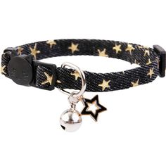 a black and gold star bracelet with a bell charm on the clasp, which is attached to