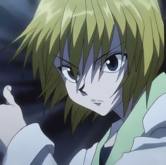 an anime character with green hair and blue eyes pointing to the side while wearing a white shirt