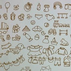 a bunch of doodles that are on top of a sheet of paper with brown ink