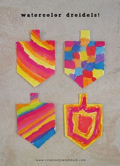 three pieces of art that are made out of colored paper