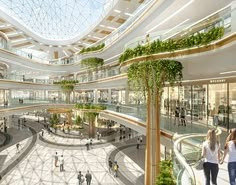 the interior of a shopping mall with people walking around and trees growing on the ceiling